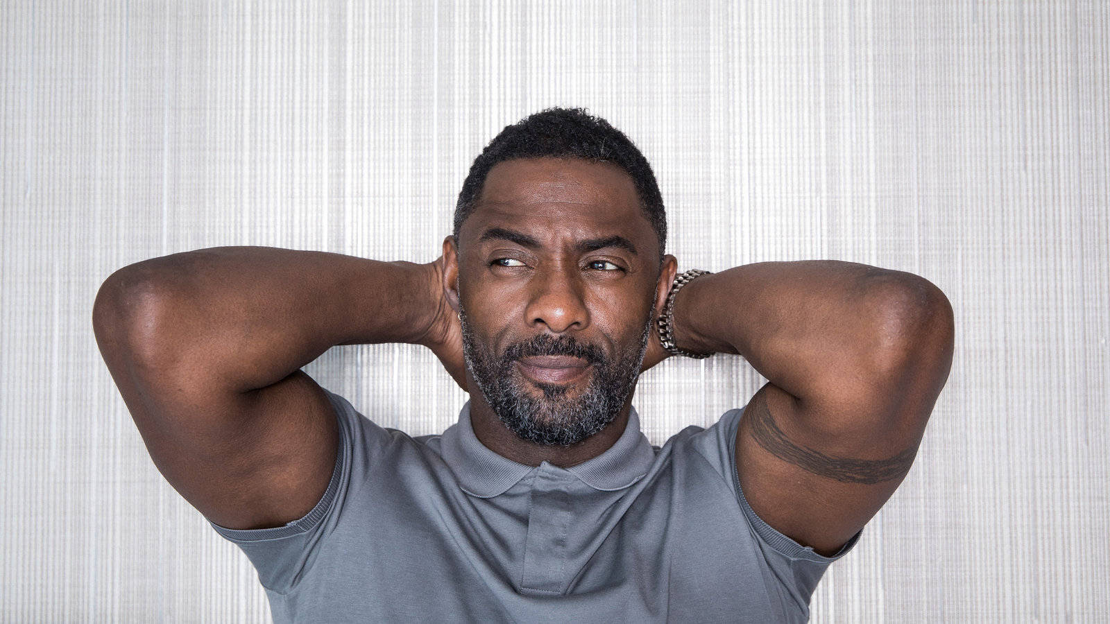 Idris Elba Hands On Back Of Head Wallpaper