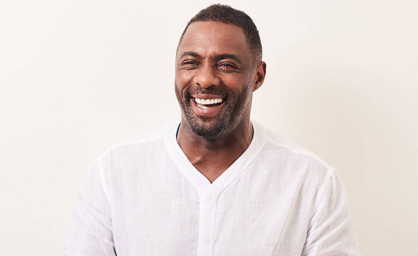 Idris Elba With White Sweater Wallpaper