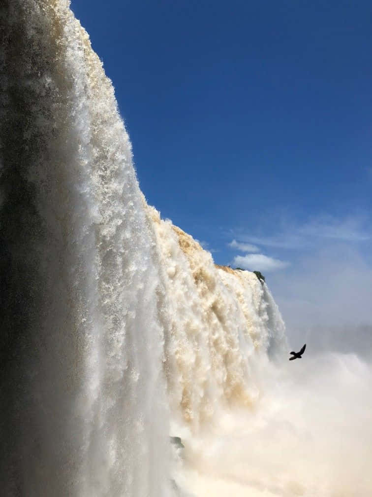 Caption: Majestic Views of Iguazu Falls - A UNESCO World Heritage Site Wallpaper