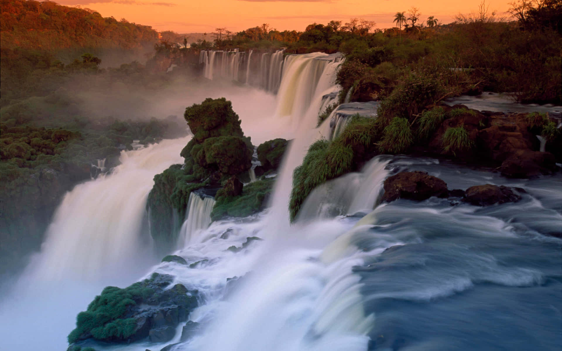 Caption: Majestic Iguazu Tiered Falls Wallpaper
