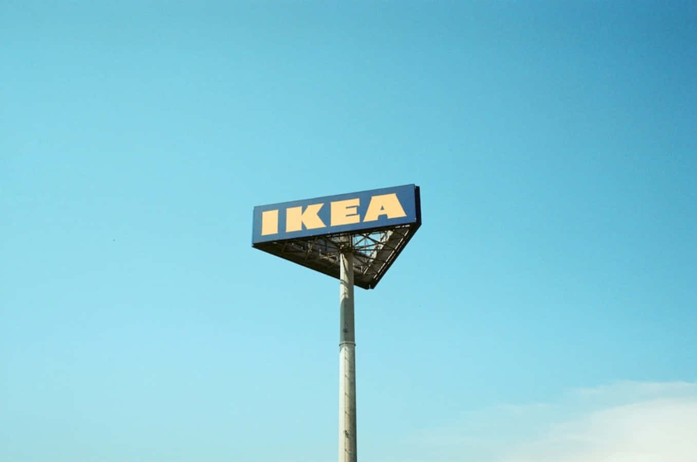 Ikea Sign On A Pole Against A Blue Sky