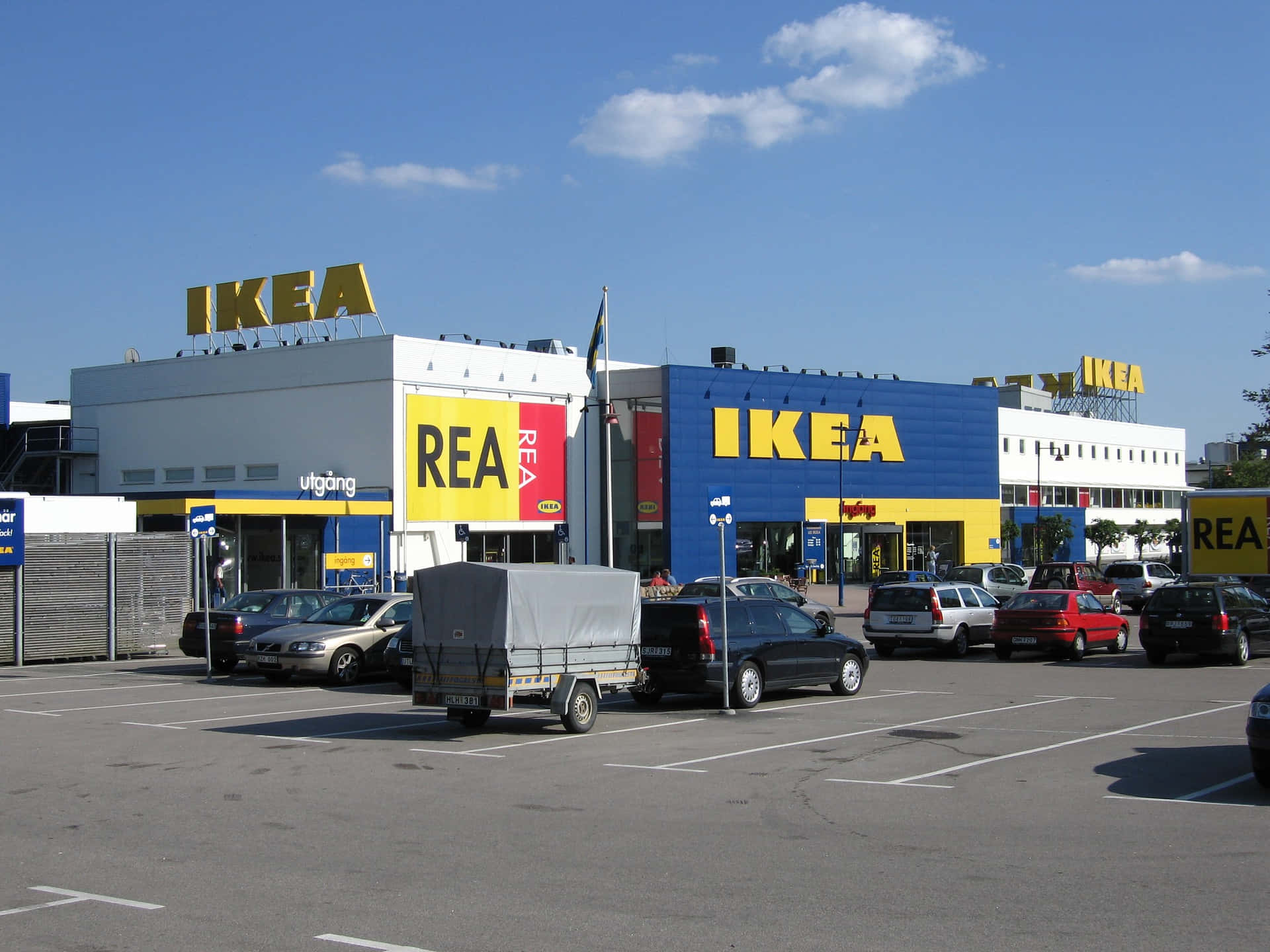 A Ikea Store With Cars Parked In Front Of It