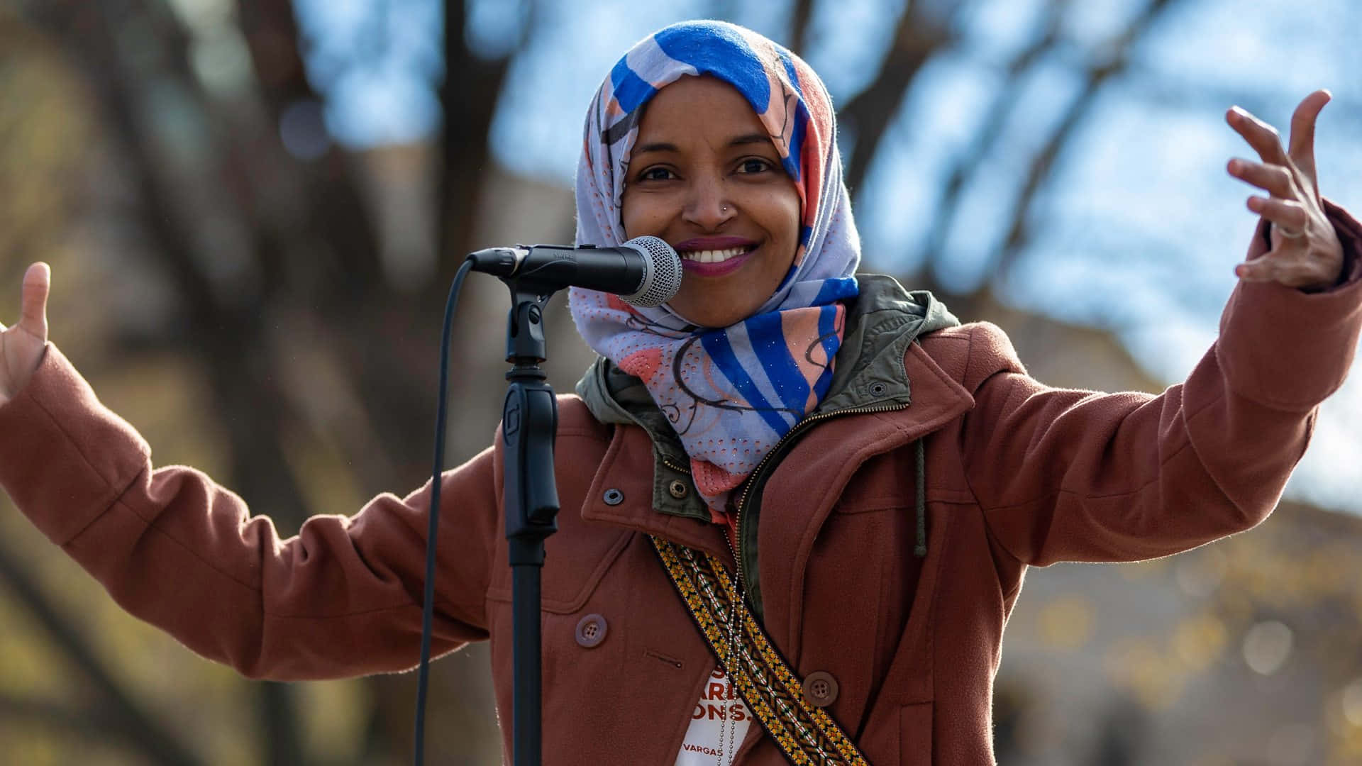Ilhan Omar Arms Wide Open Wallpaper