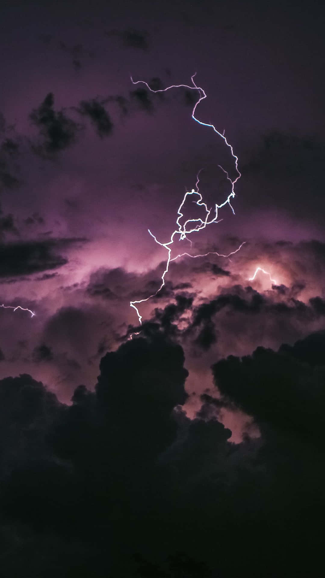 Illuminated Electric Bulbs Against A Dark Sky