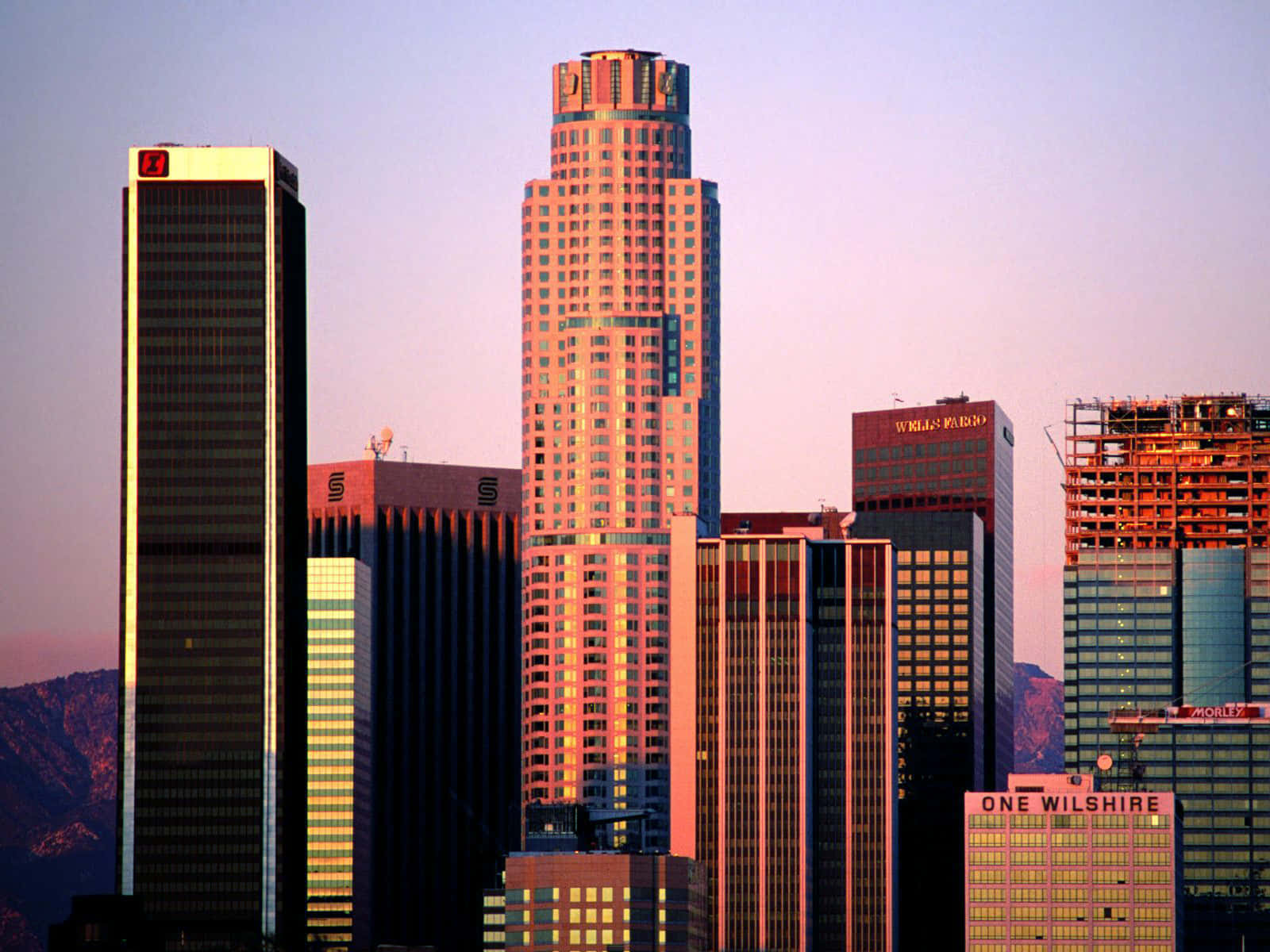 Illuminated Los Angeles Skyline At Dusk Wallpaper