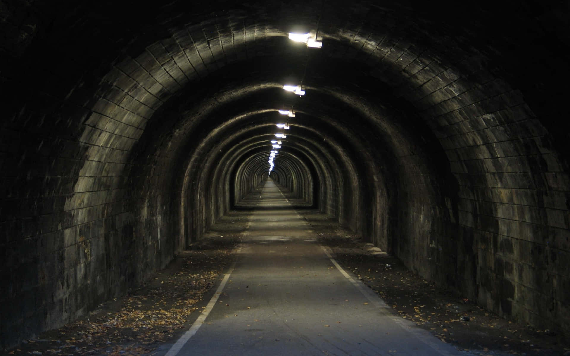 Illuminated Stone Tunnel Perspective.jpg Wallpaper