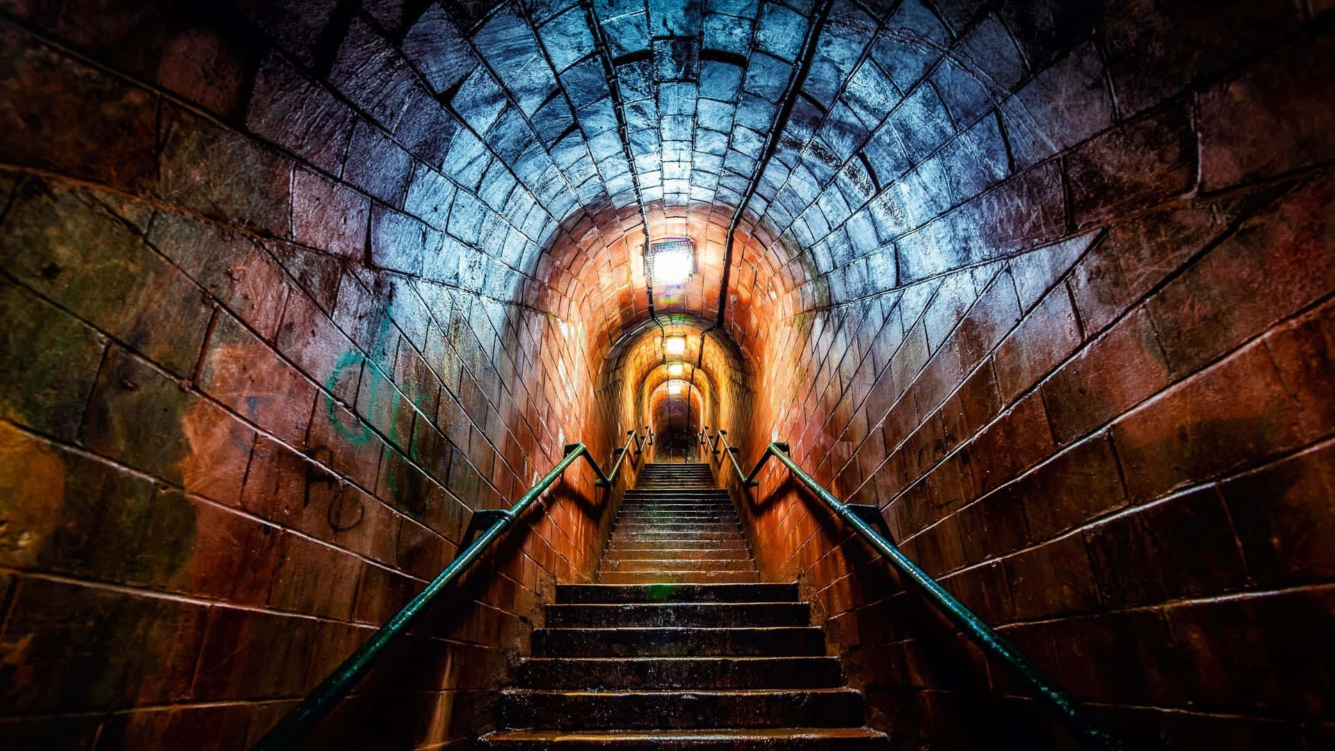 Illuminated Stone Tunnel Staircase Wallpaper