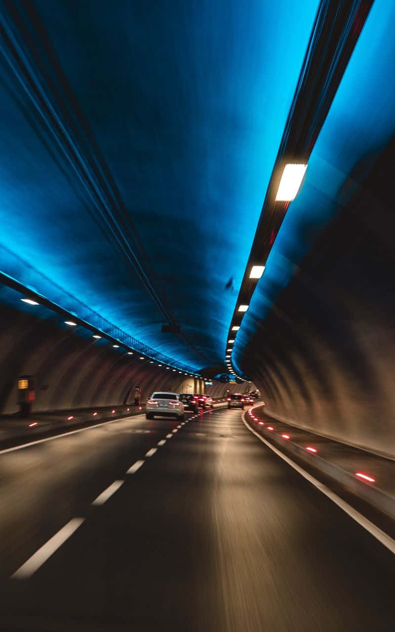 Illuminated Tunnel Traffic Flow Wallpaper