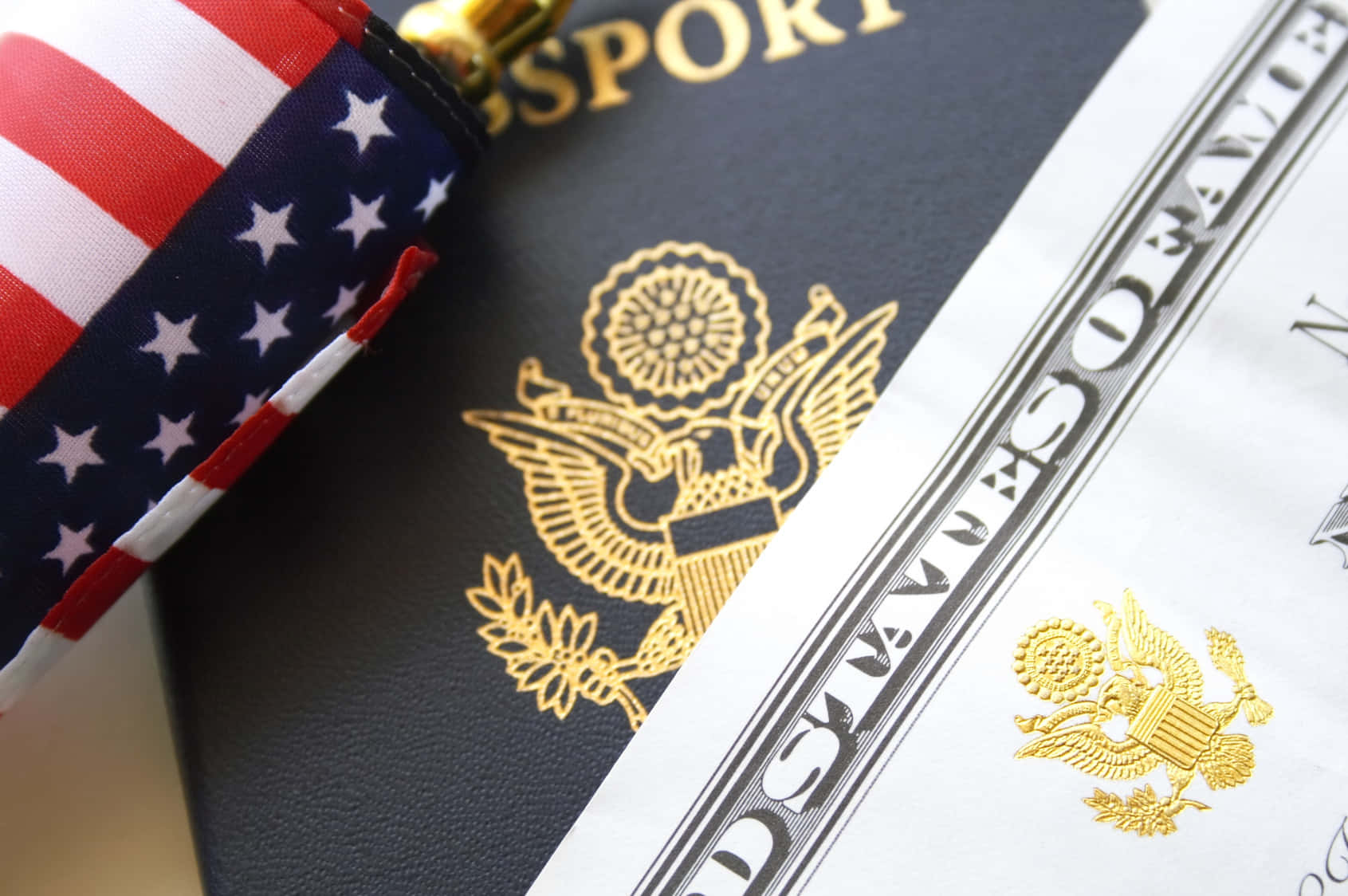 A Passport And An American Flag On Top Of A Table