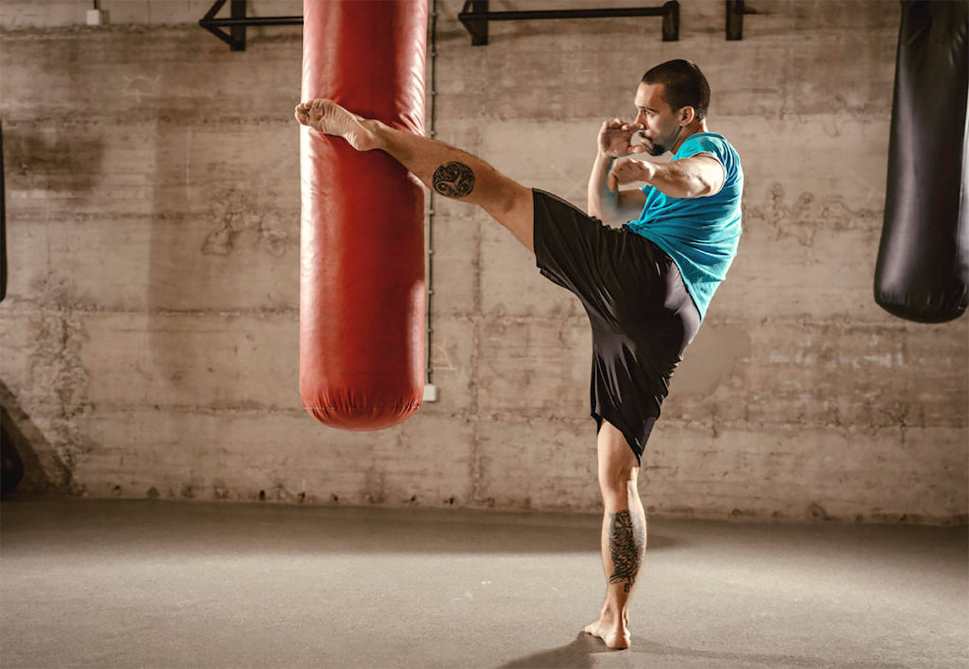 Intense Full-Body Kickboxing Training Session Wallpaper