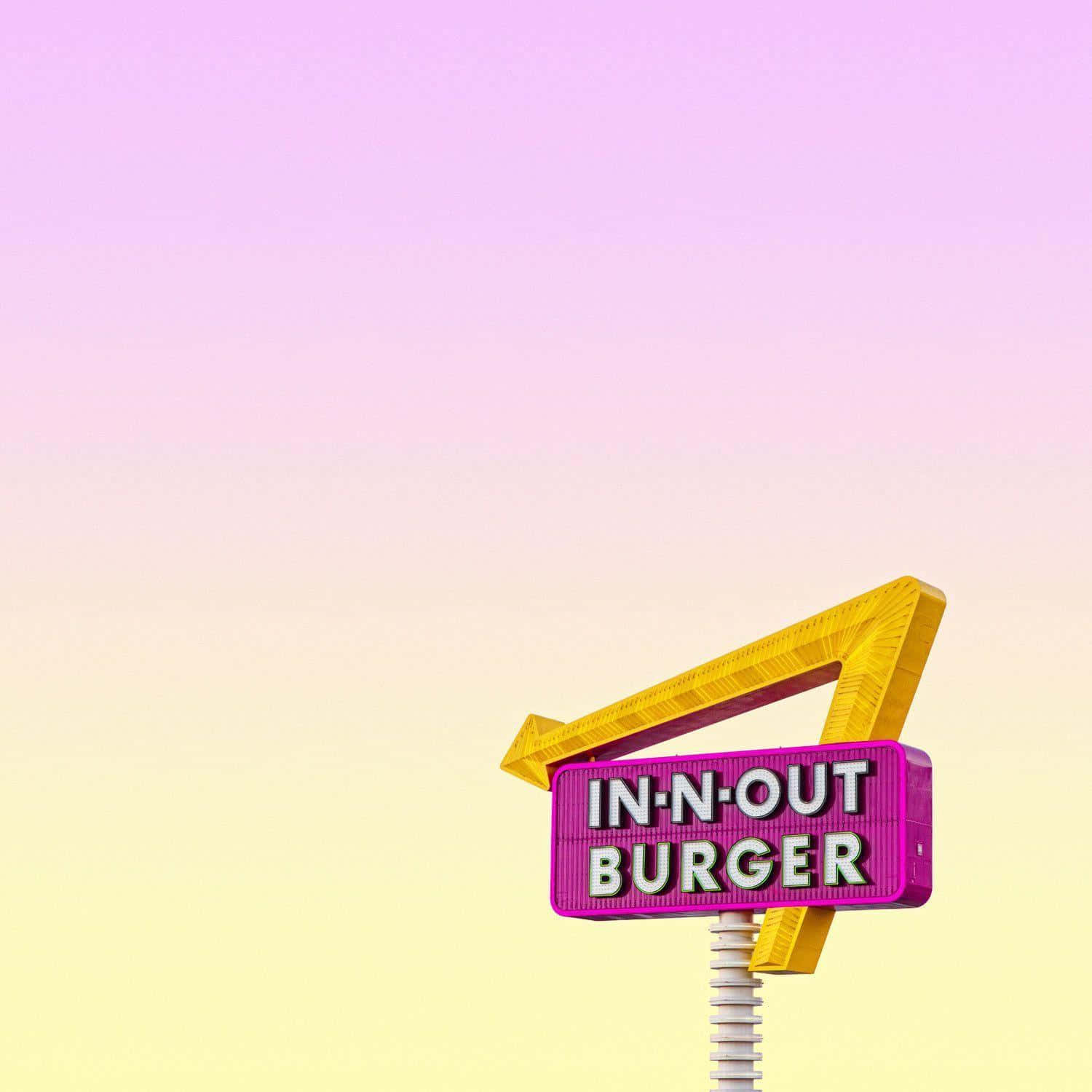 A Neon Sign With A Yellow And Pink Background Wallpaper