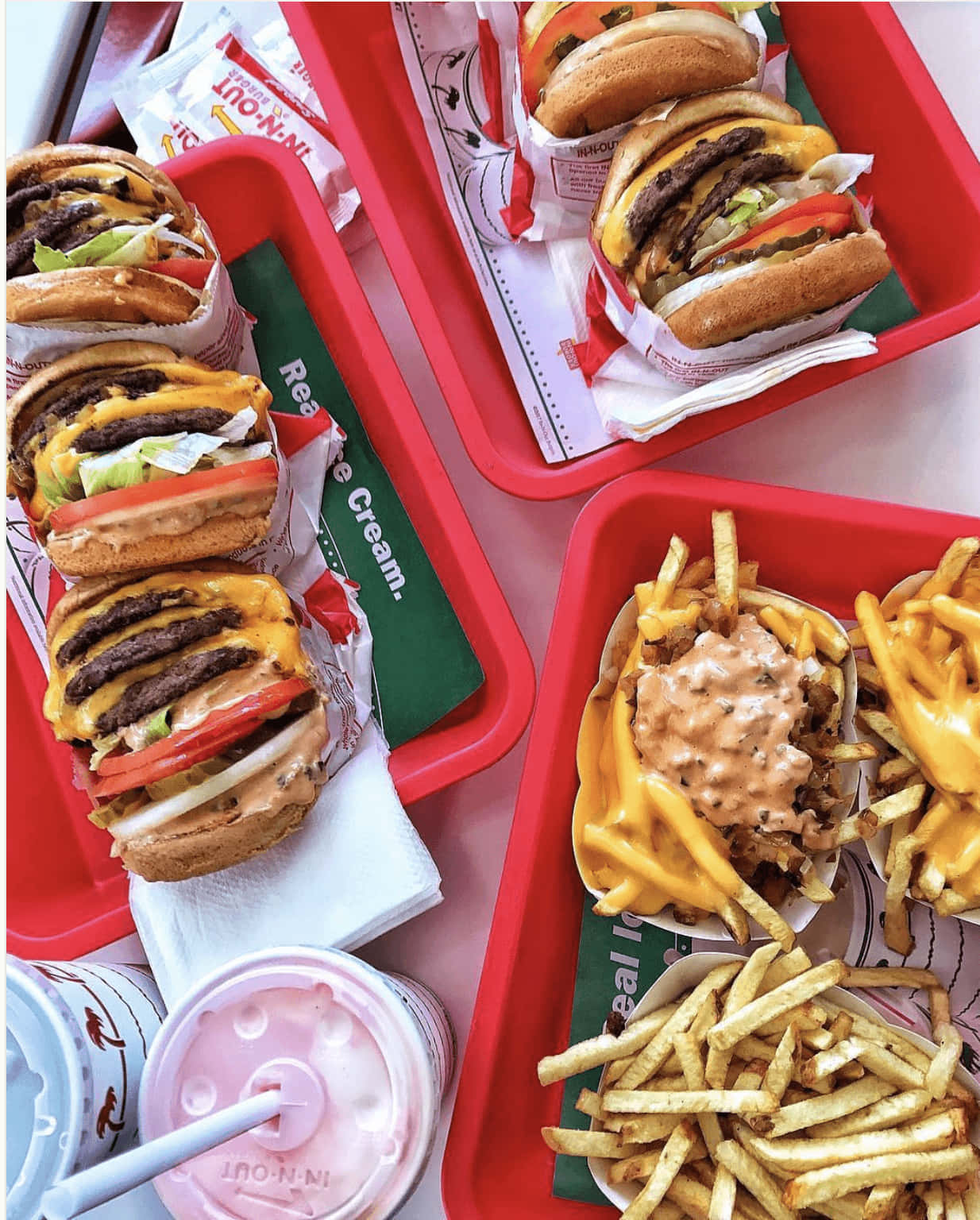 A Tray Of Food With Fries And A Burger Wallpaper