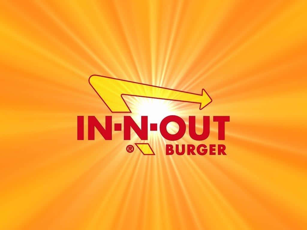 Logoet for In-Out Burger med et solopgangsbaggrund Wallpaper