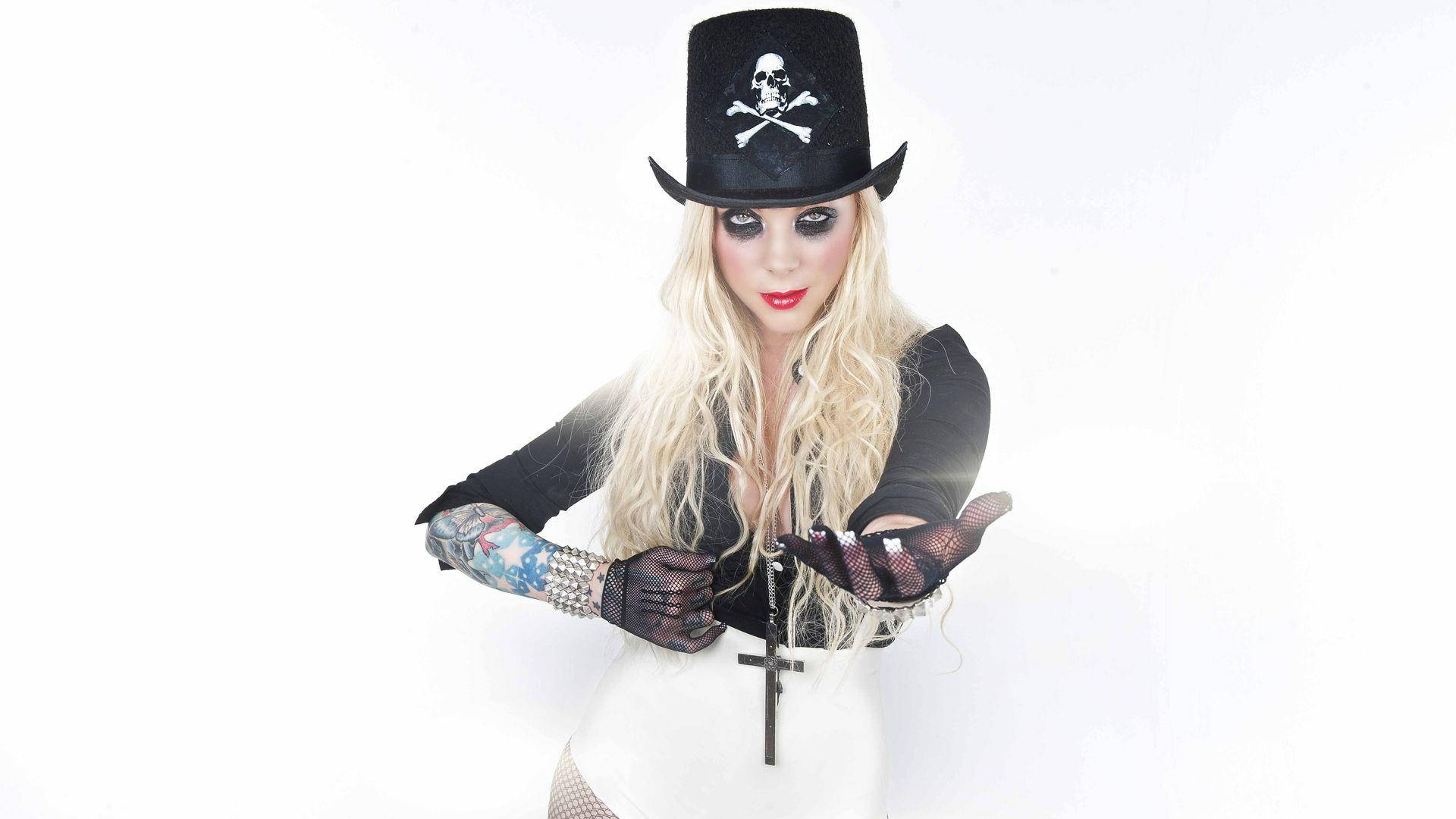 Maria Brink, the dynamic singer of In This Moment in action Wallpaper