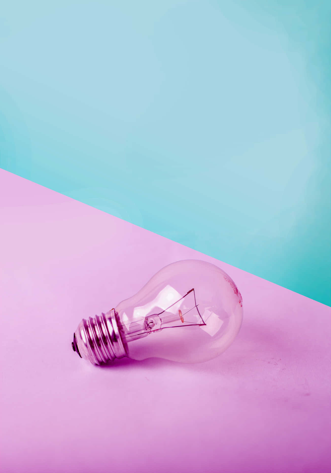 Incandescent Bulb On Pink Surface Wallpaper