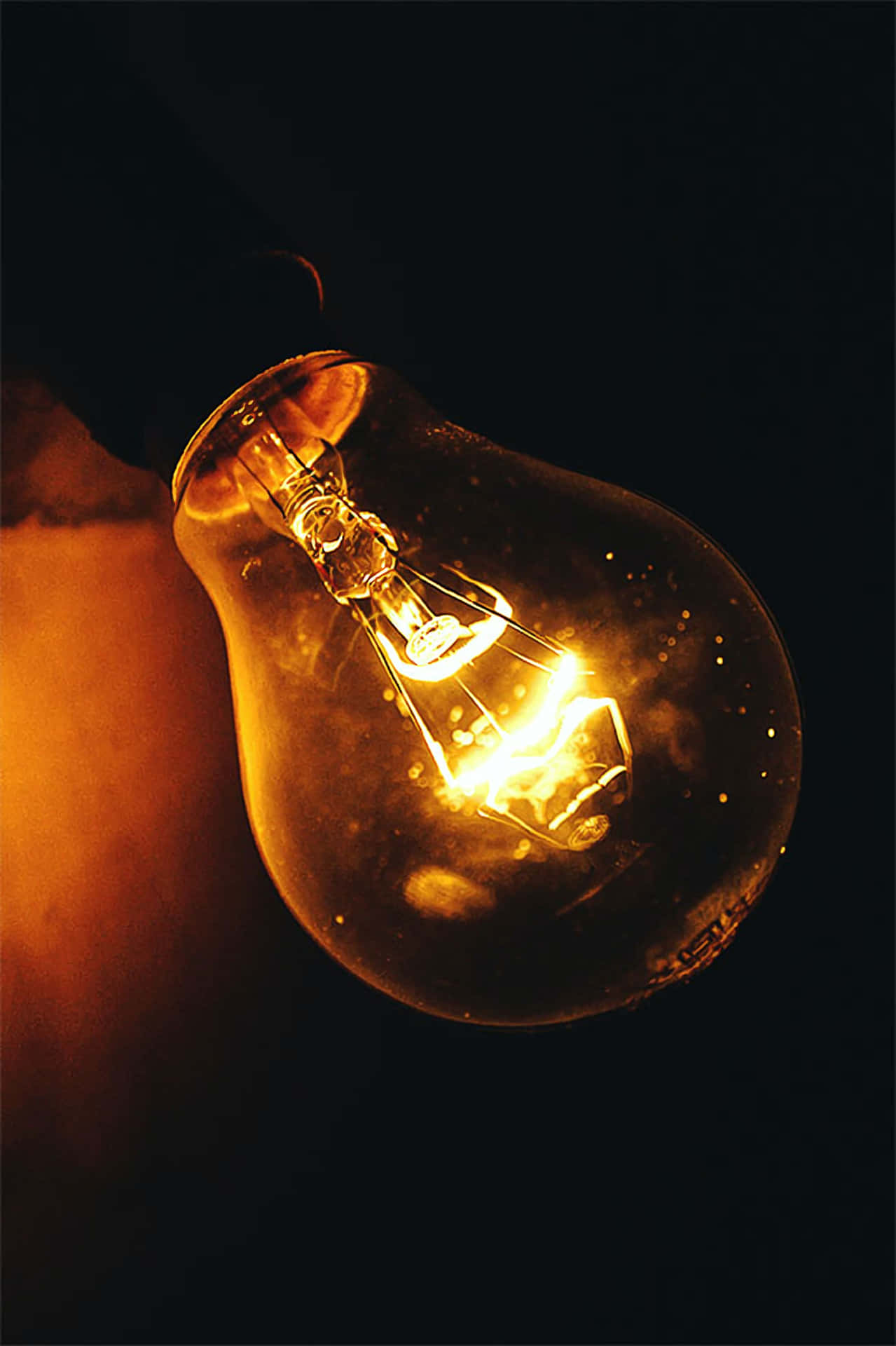 Incandescent Bulb With Glitters Wallpaper