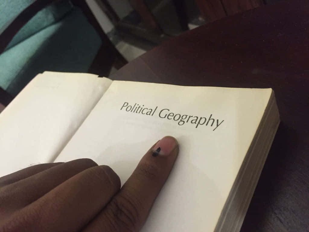 Indelible Ink On Hand While Scanning A Book Wallpaper