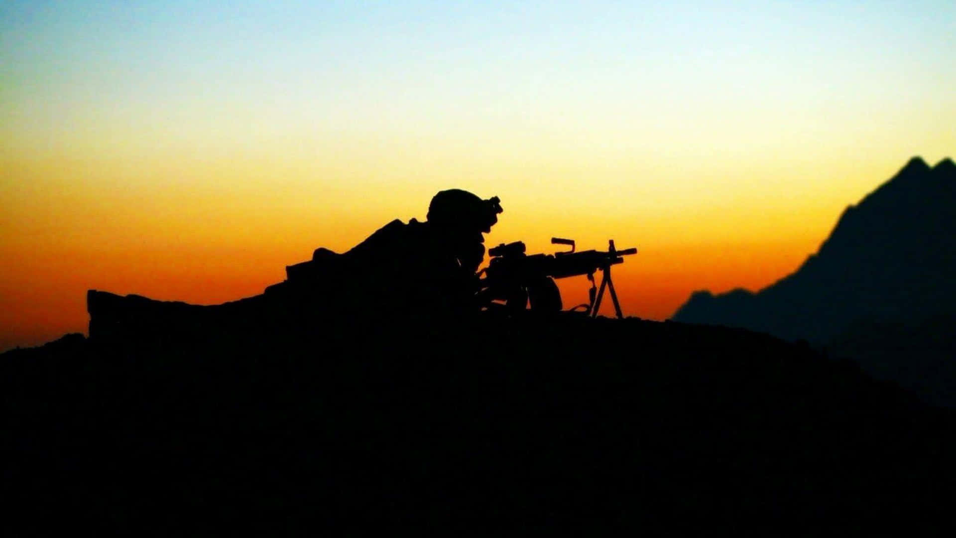 A Silhouette Of A Soldier On Top Of A Mountain