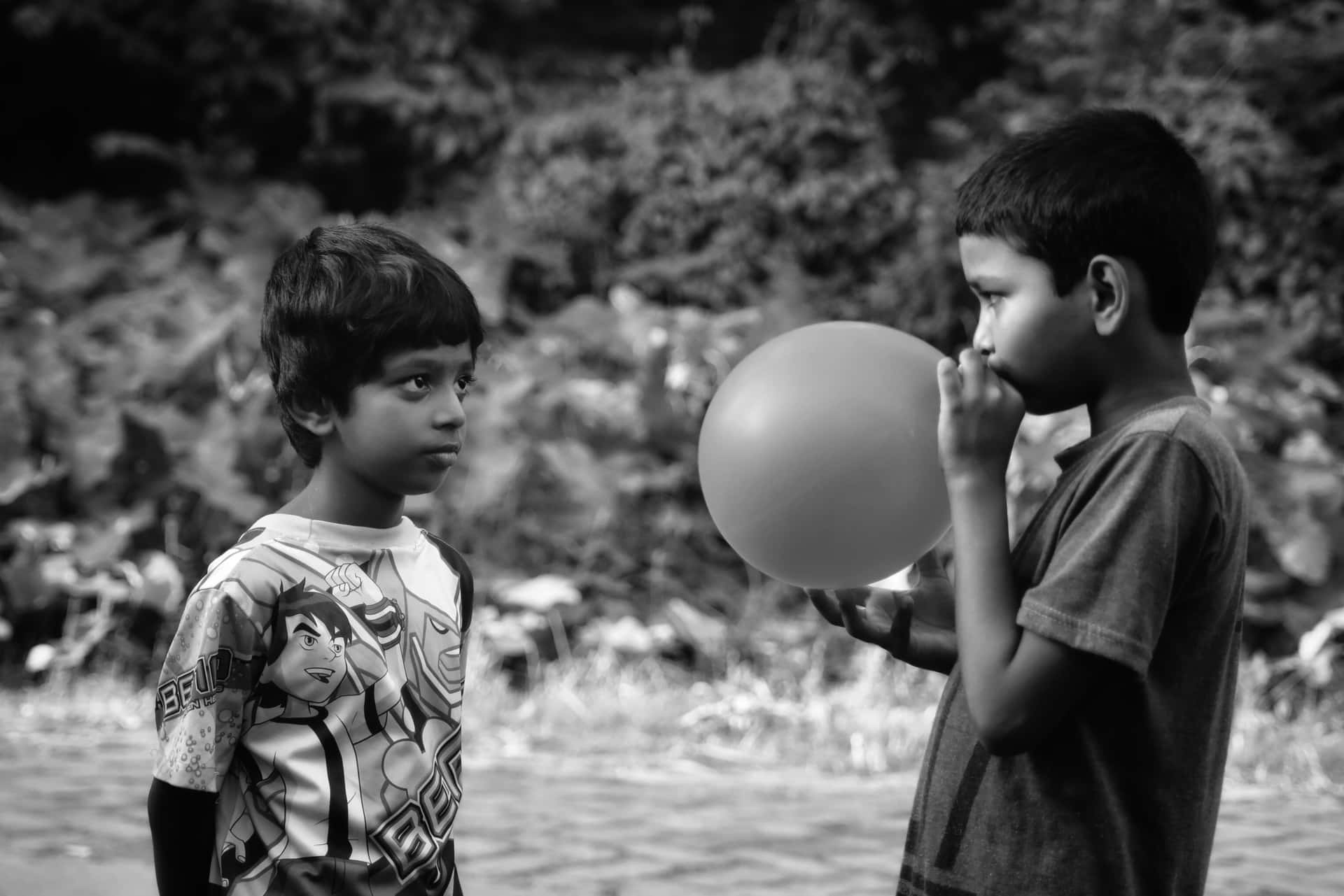 Indian Boy Blowing Balloon Picture