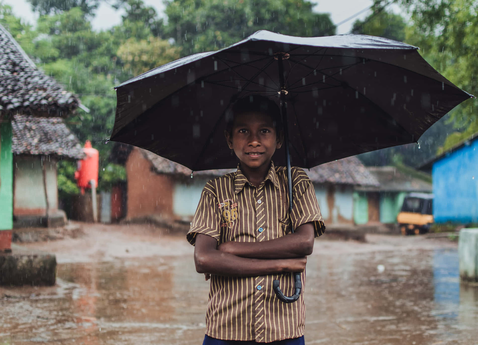 Indian Boy With Umbrella Picture