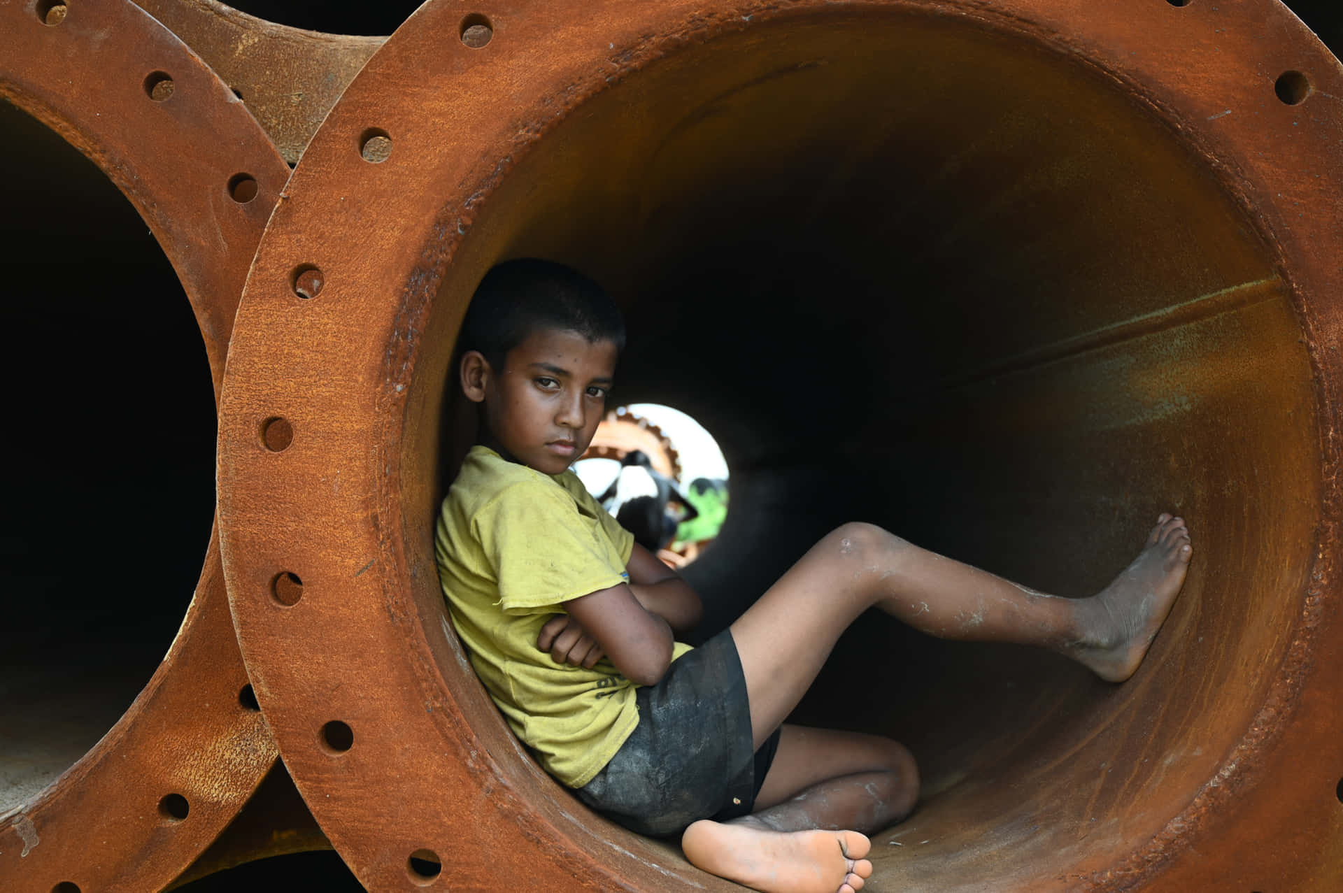 Indian Boy Sitting Inside The Sewer Picture