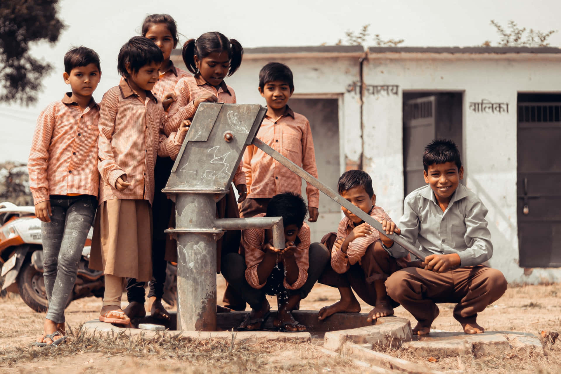 Indian Boys Manual Water Pump Picture