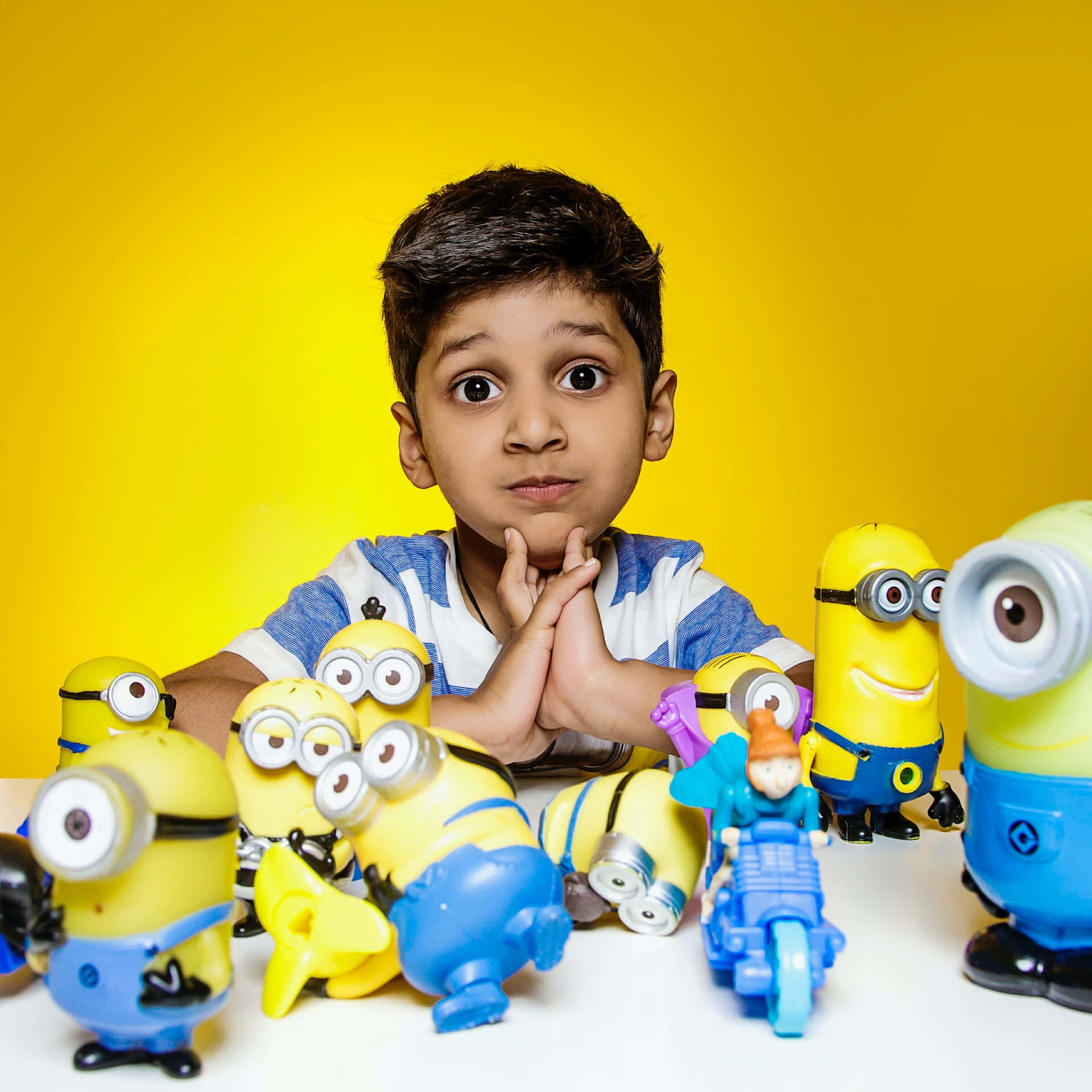 Indian Boy With Minion Toys Picture
