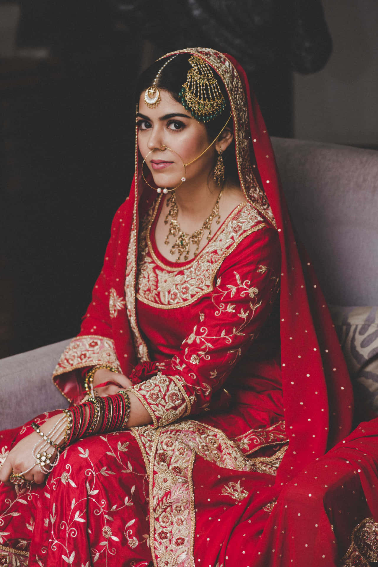 Indian Bride Sitting On Couch Picture