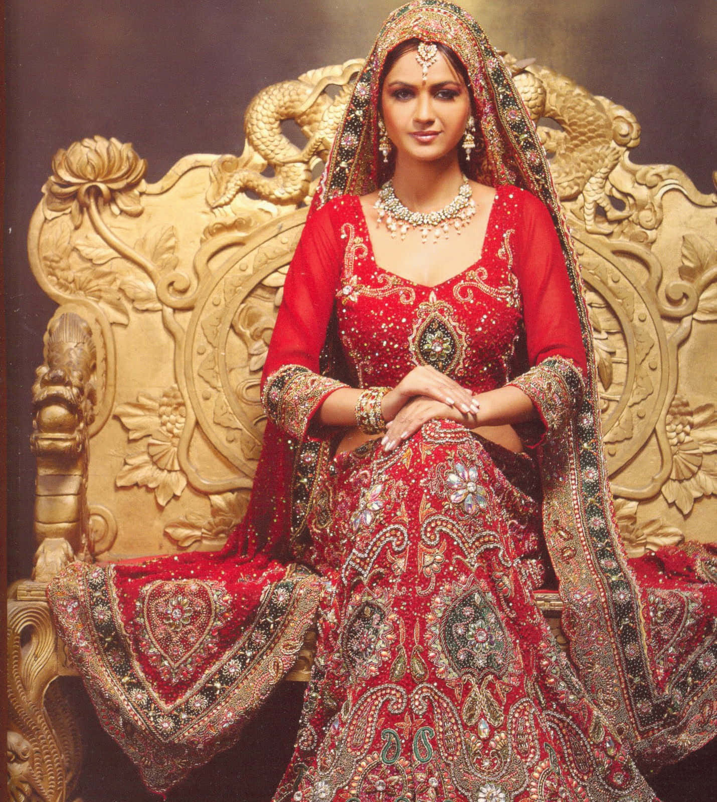 Indian Bride Sitting On Golden Chair Picture