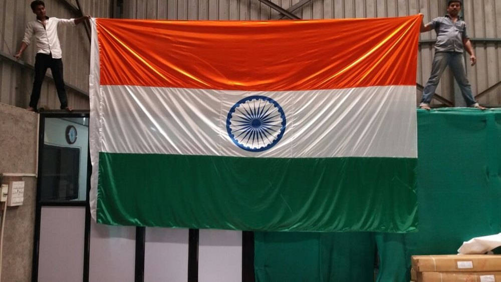 Indian Flag With Two Men Holding Background