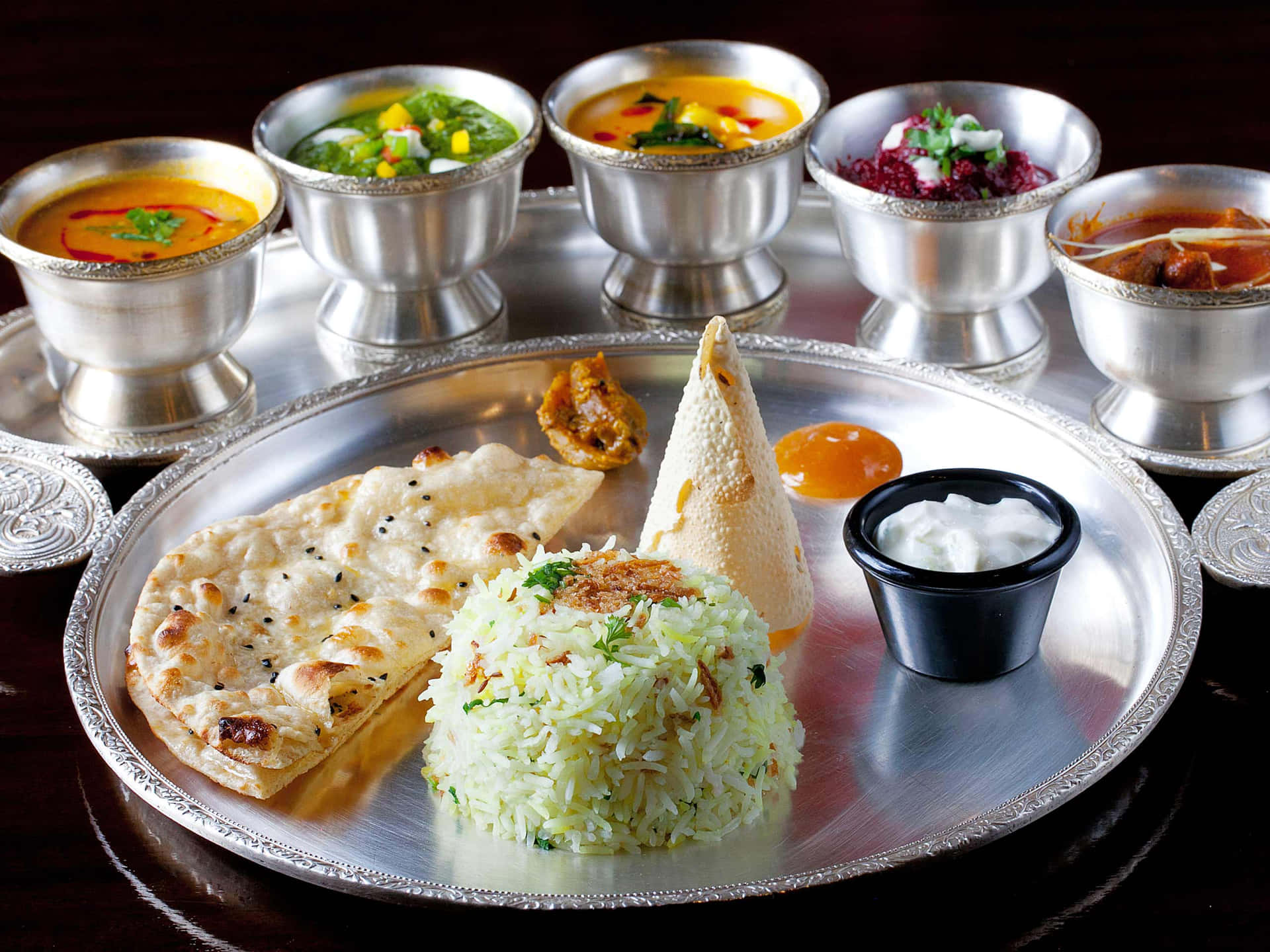 A colorful assortment of Indian food dishes, bursting with flavor and tradition