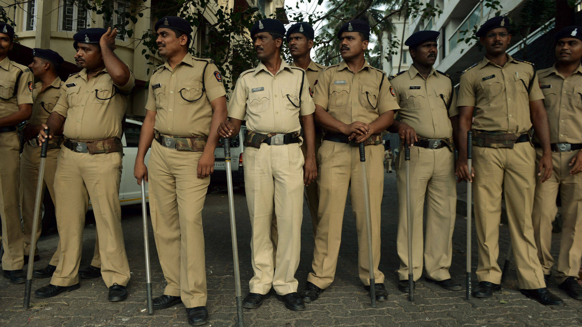Indian Police Resting With Batons