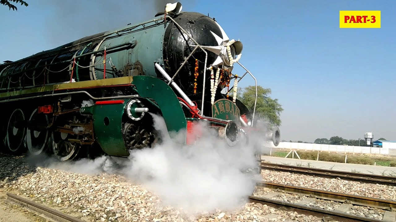 A Steam Train Is Pulling Steam Out Of The Tracks
