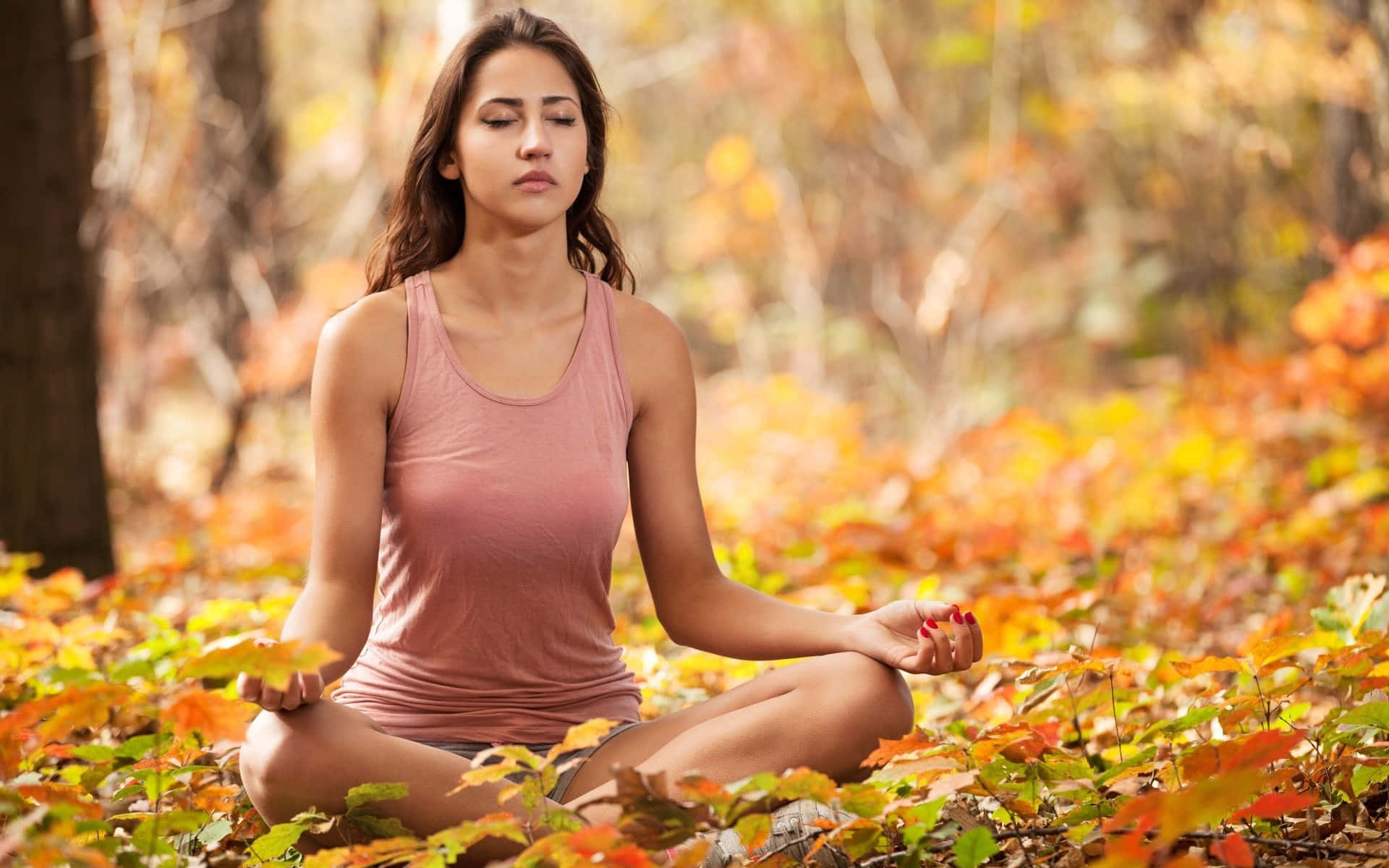 Indian Woman Doing Yoga In Autumn Landscape Wallpaper