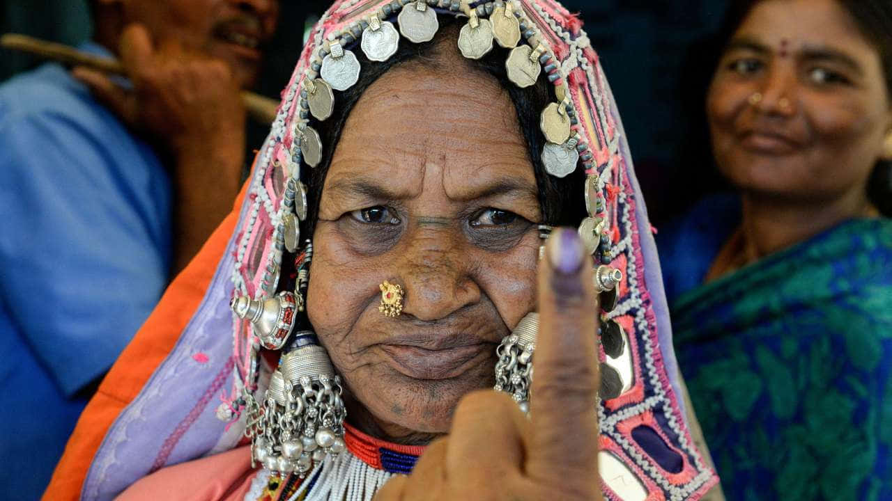 Indian Woman With Idelible Ink On Its Nail Wallpaper