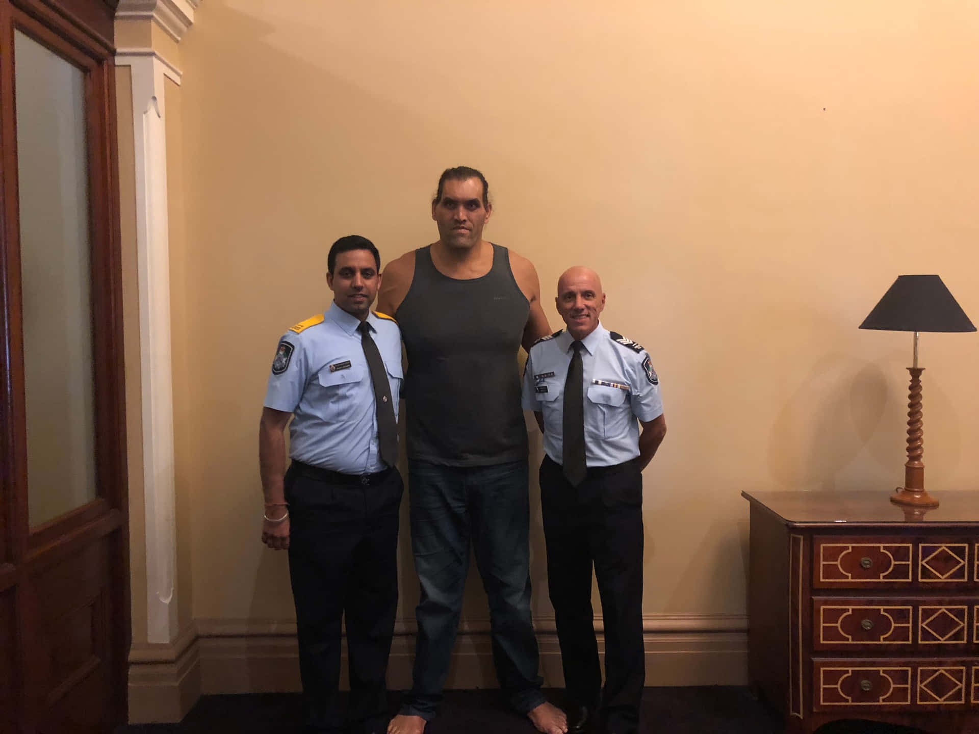 Indian Wrestler The Great Khali With Queensland Police Service Wallpaper
