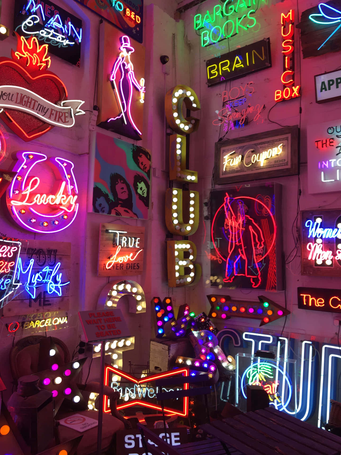 A Room Full Of Neon Signs And Other Items Wallpaper