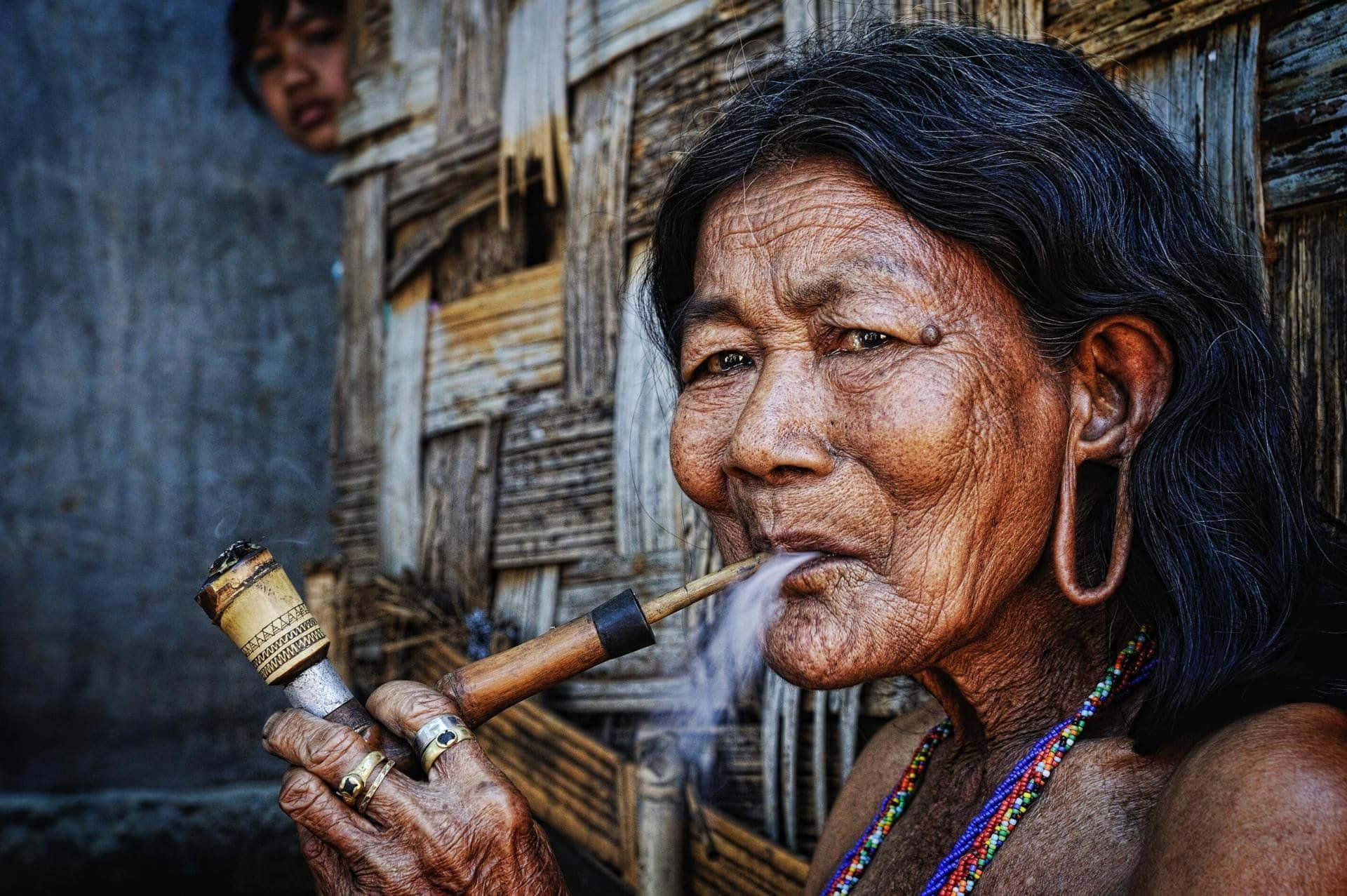 Indigenous Old Lady Smoking Wallpaper