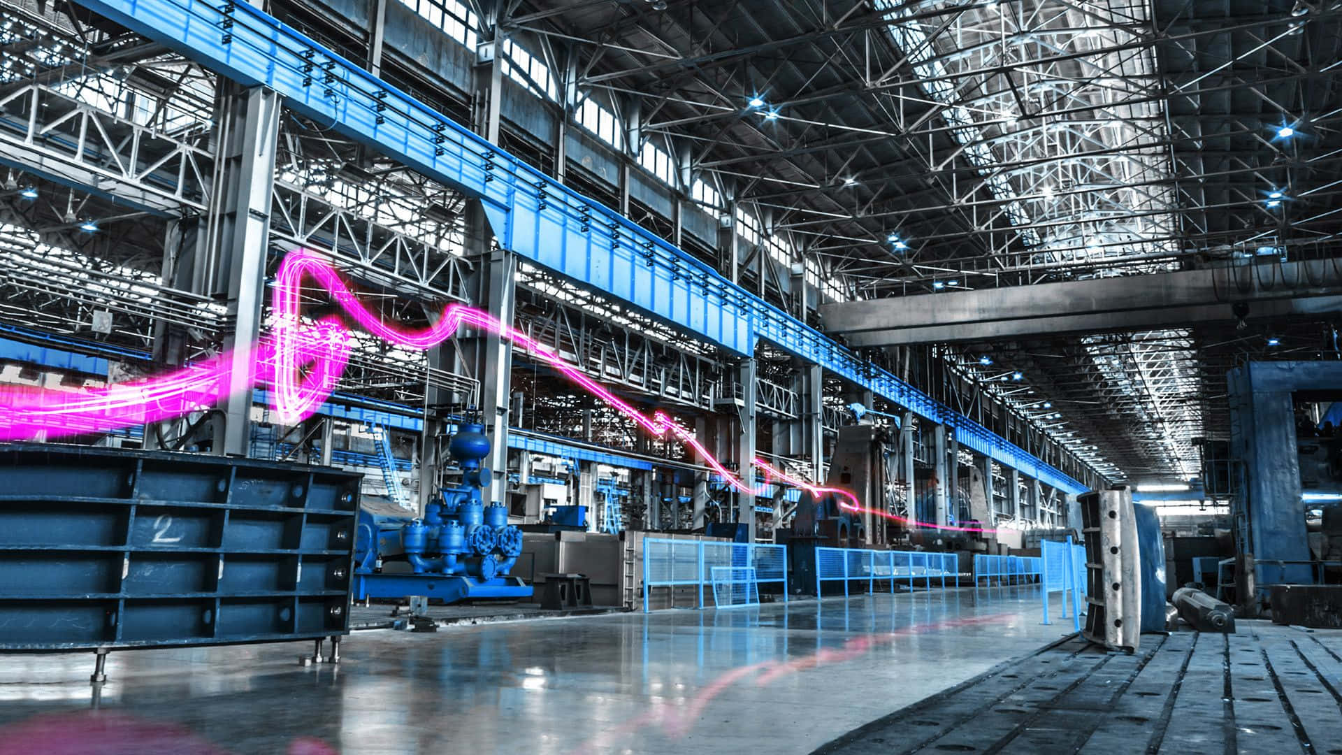 A Large Factory With A Pink Light