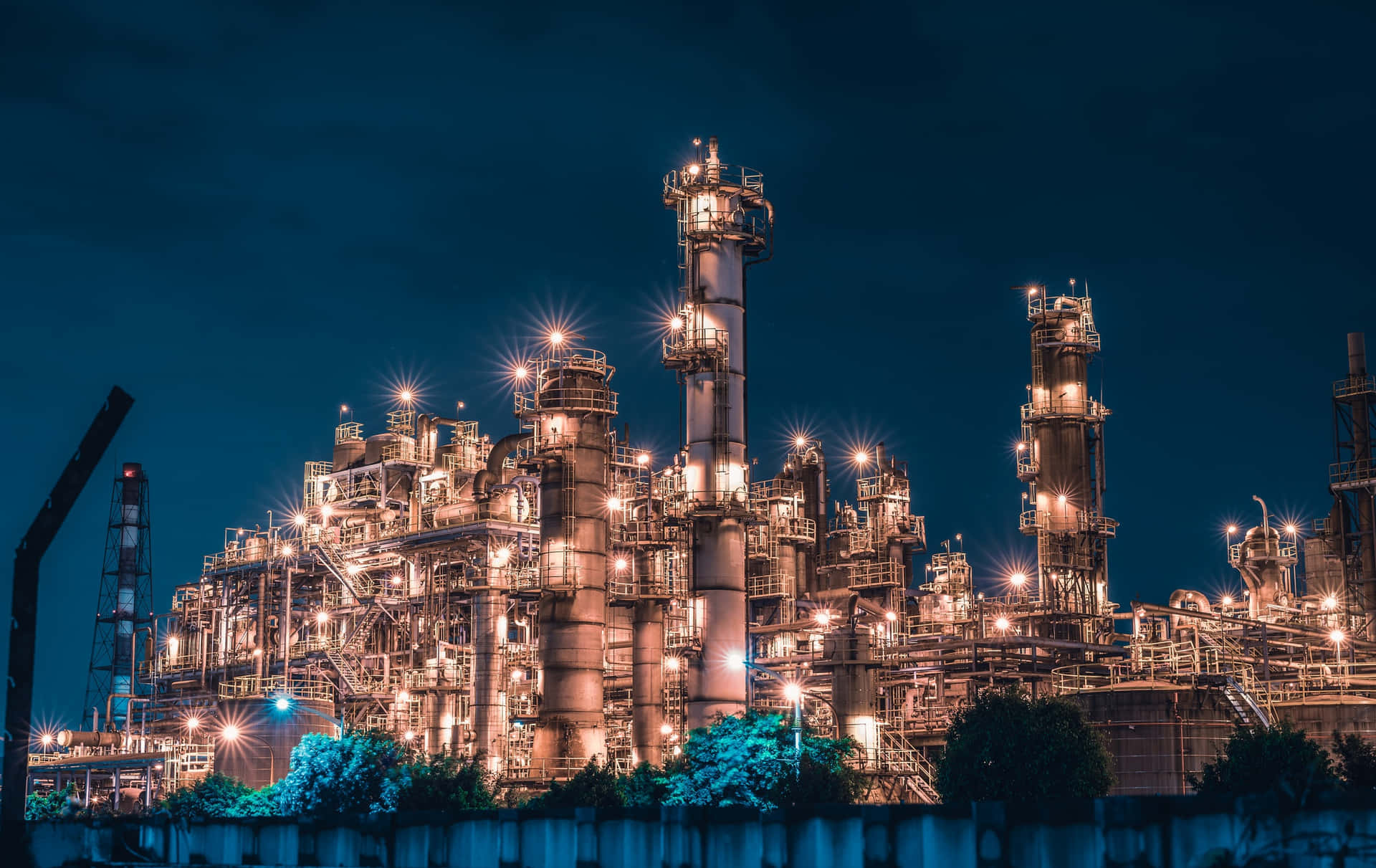 A Large Refinery At Night With Lights On