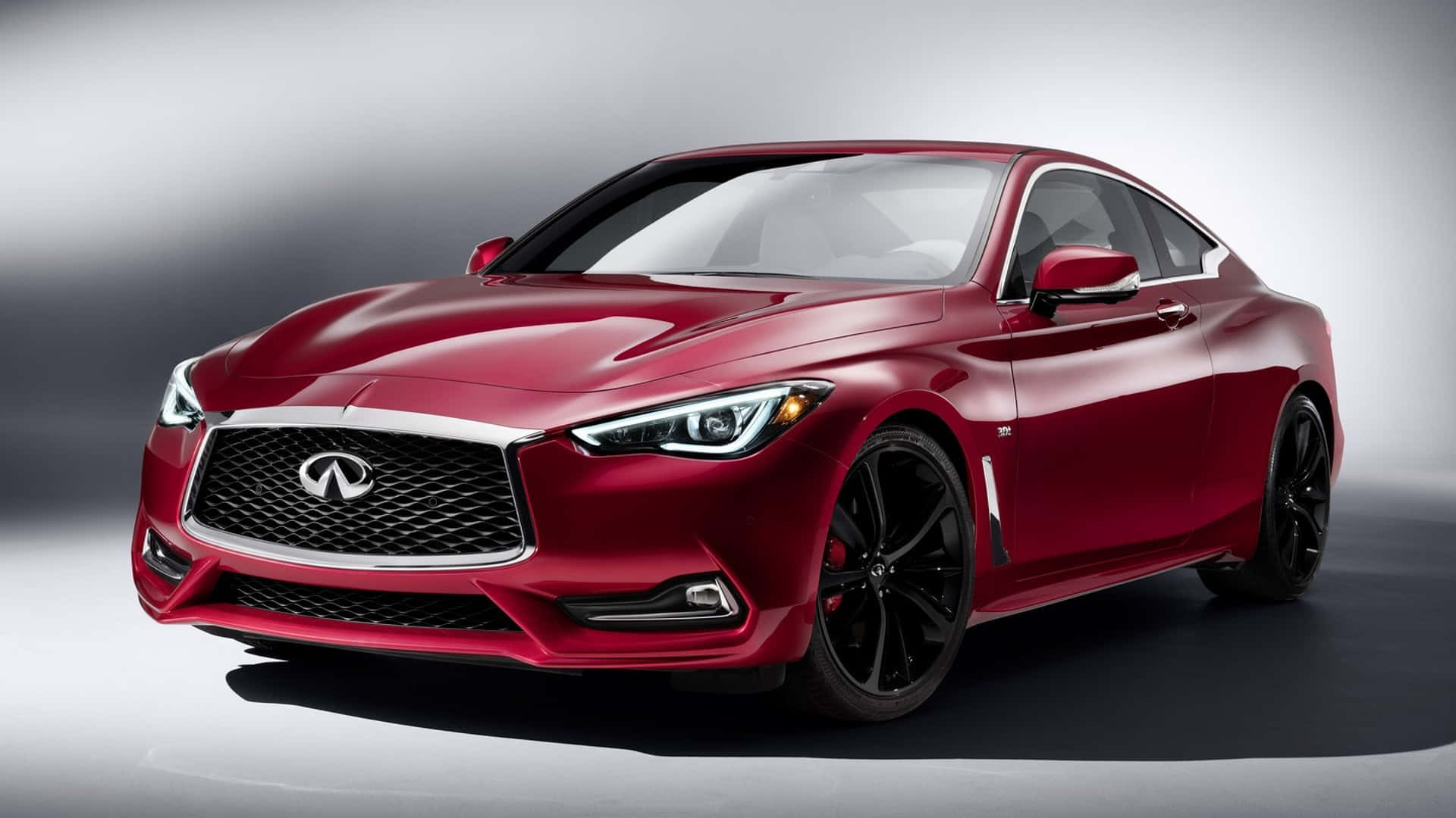 Sleek and Stylish Infiniti Q60 in Motion Wallpaper