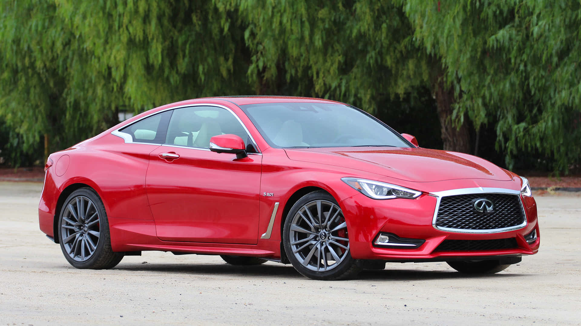 Sleek Infiniti Q60 Sports Coupe in action Wallpaper