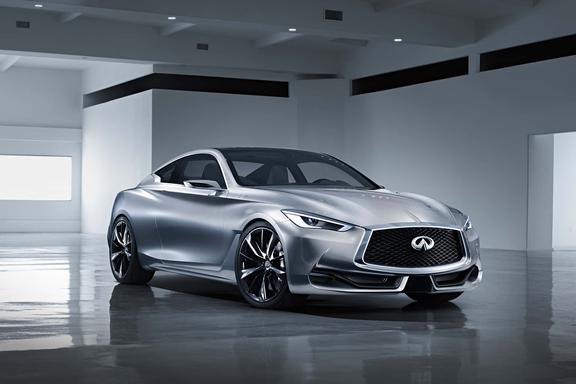 Sleek and Stylish Infiniti Q60 on the Road Wallpaper