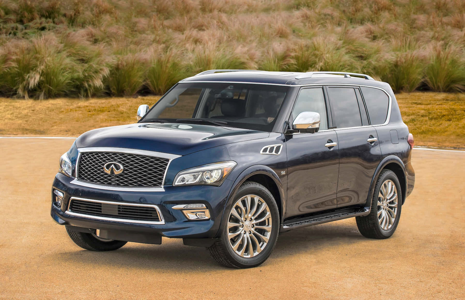 Sleek and Luxurious Infiniti QX80 on the Road Wallpaper