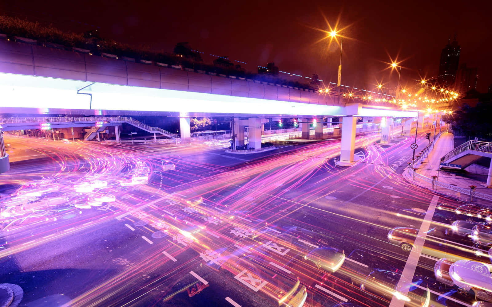 A scenic view of modern bridges and roads, showing the expanse of infrastructure in the city. Wallpaper