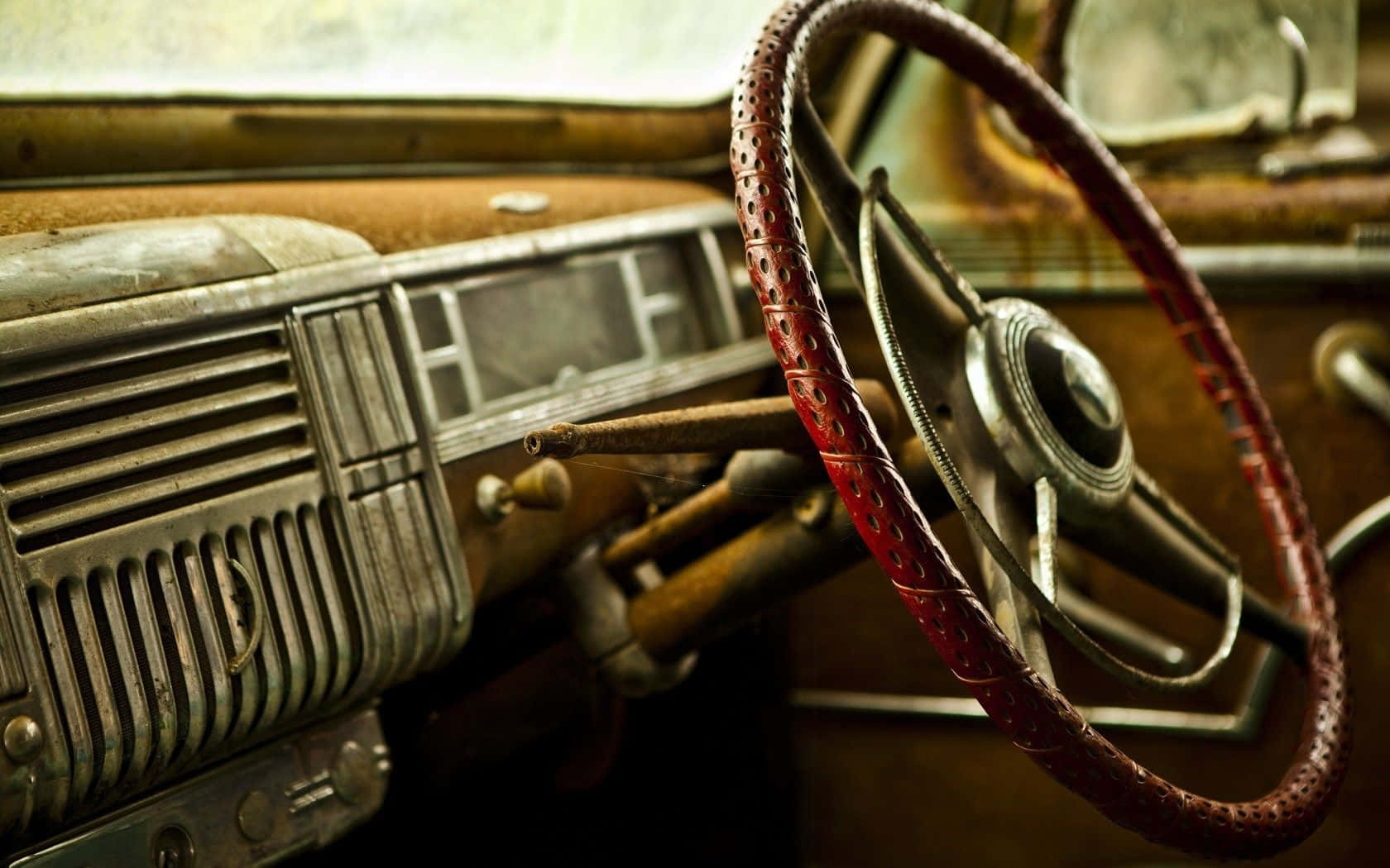 An Old Car With A Steering Wheel And Steering Wheel