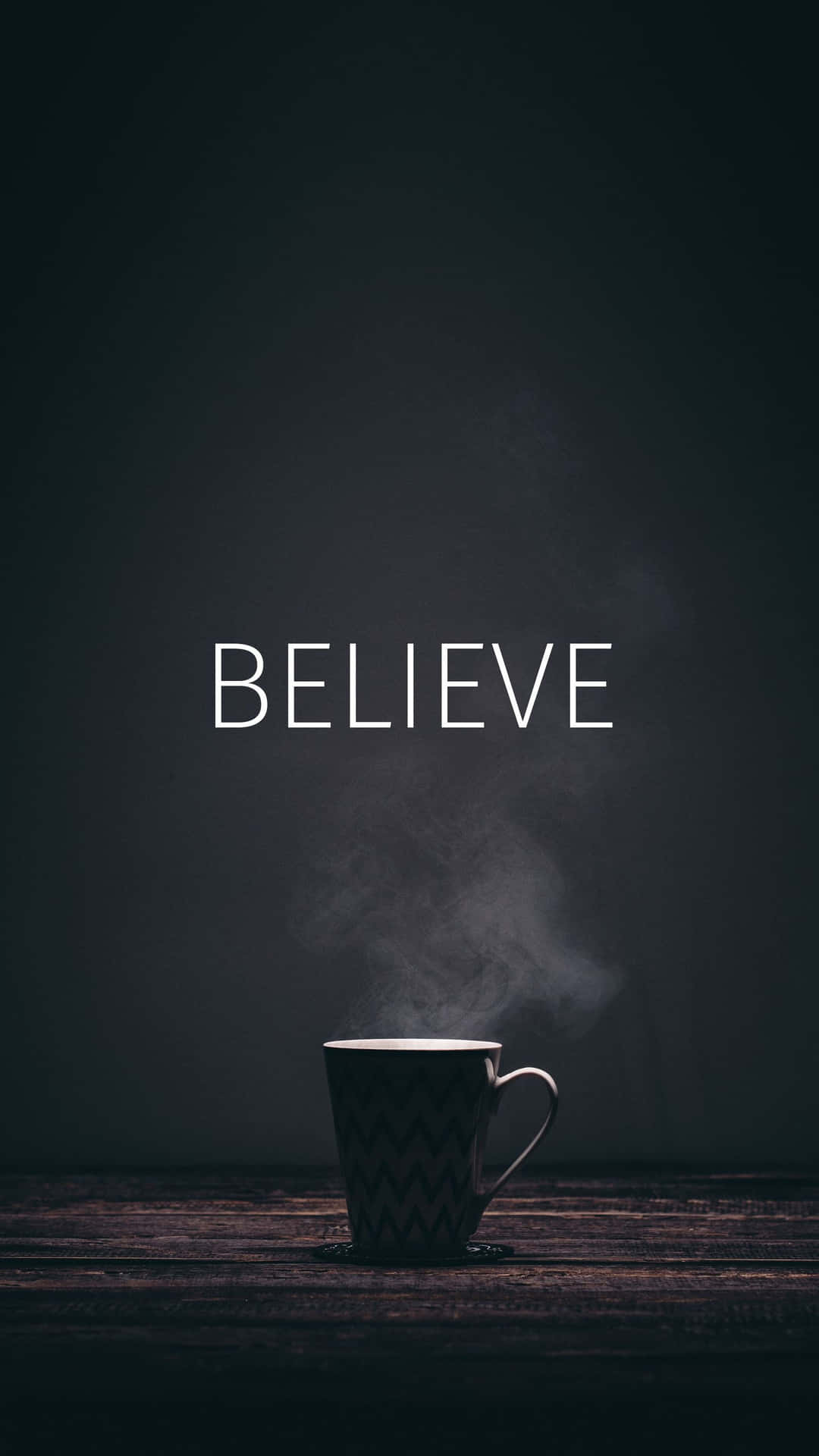 A Cup Of Coffee With The Word Believe On It