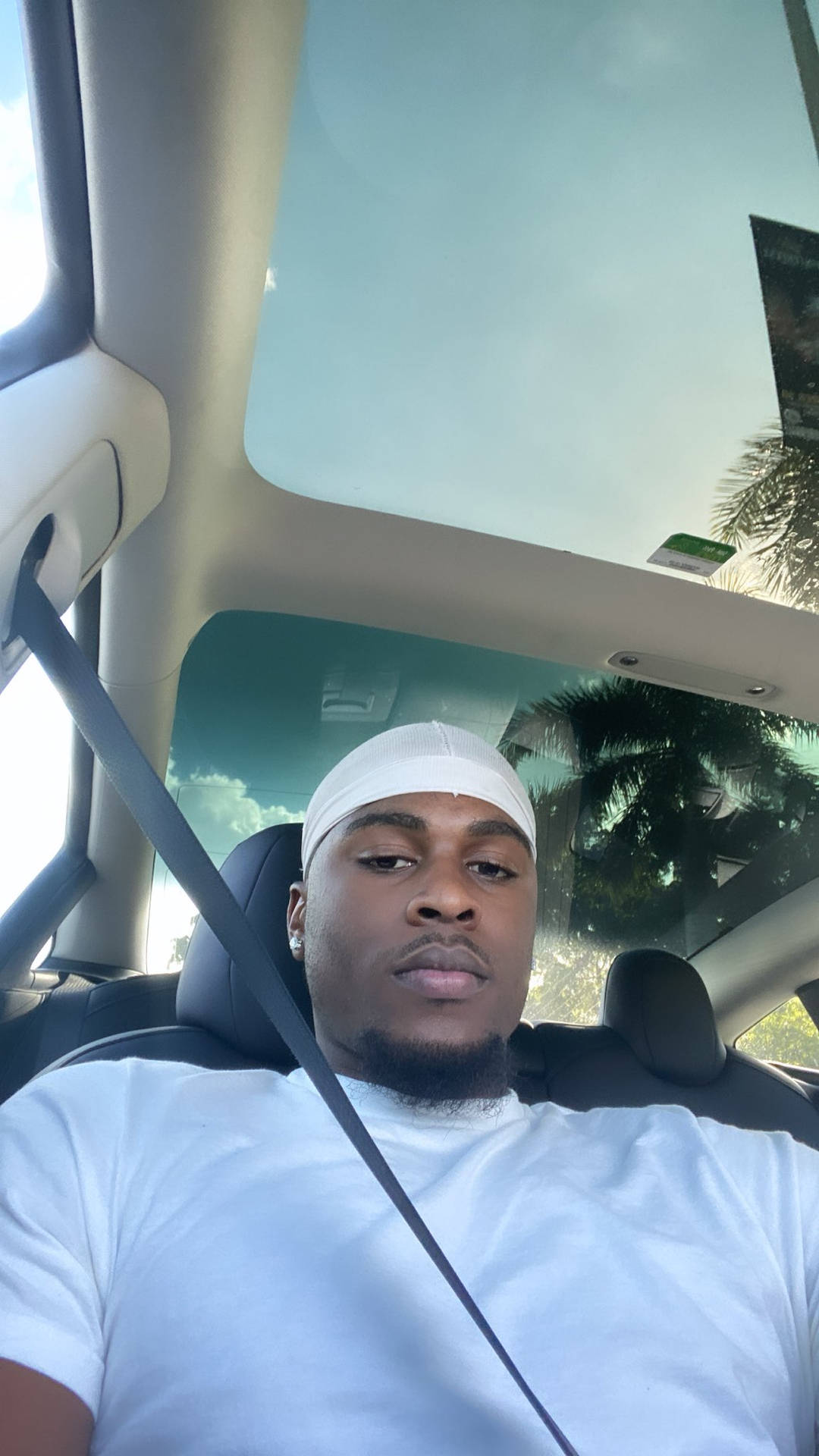 Caption: Instagram Star Swavy Lee Living the White-Themed Luxury in a Car Selfie Wallpaper