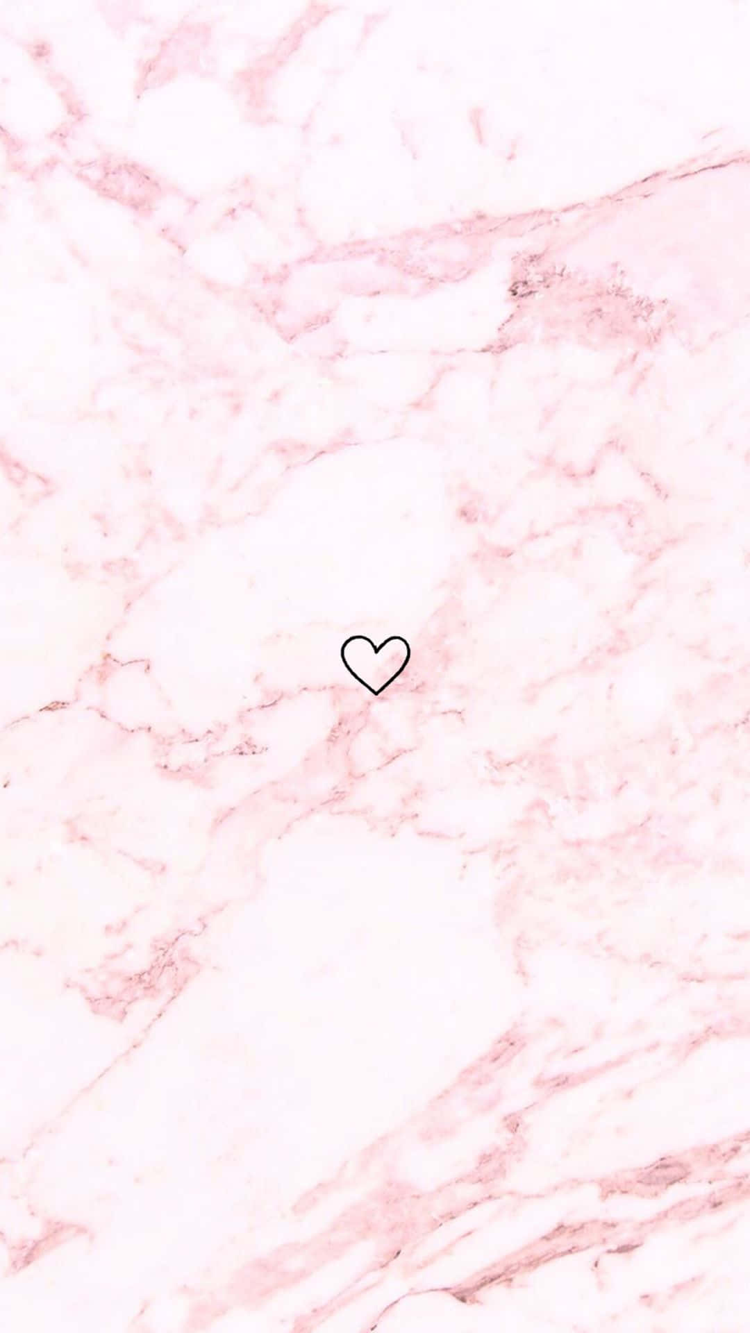A Pink Marble Background With A Heart On It