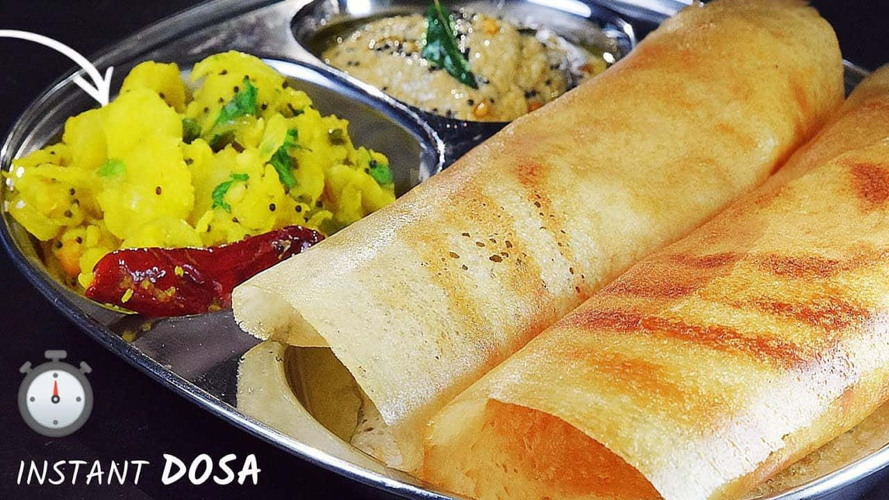 Instant Dosa Served With Chutneyand Potato Side Dish Wallpaper